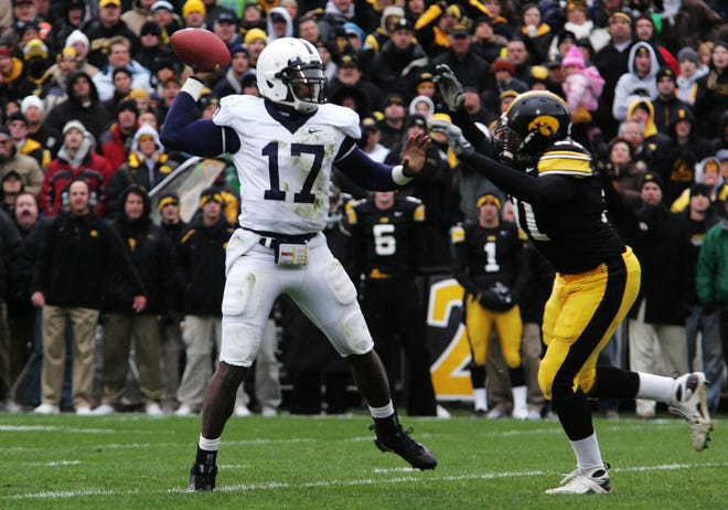 Penn State quarterback Daryl Clark gets pressured by Iowa's Broderick Binns during the first half of the game at Kinnick Stadium on Saturday, Nov. 8, 2008, in Iowa City.