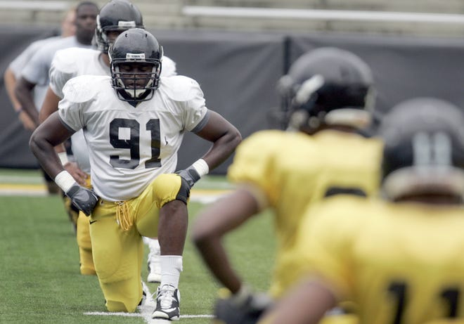 Iowa's Broderick Binns stretches with teammates at the start of the Kids at Kinnick Day practice on Saturday, Aug. 13, 2011, at Kinnick Stadium, in Iowa City, Iowa.
