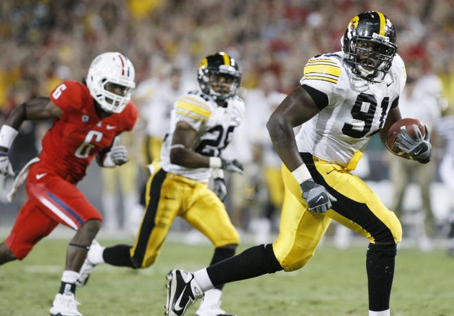 Iowa's Broderick Binns (91) returns the ball for a touchdown to tie the game against Arizona in the fourth quarter at Arizona Stadium in Tucson, Arizona, on Sept. 18, 2010.