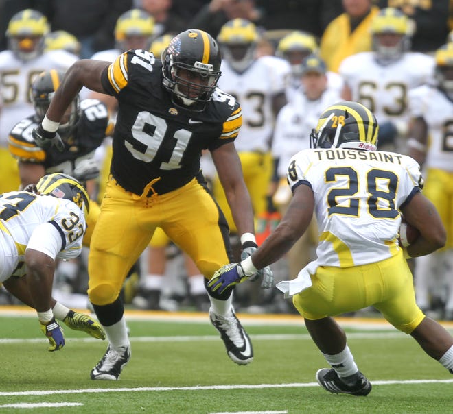 Iowa defensive lineman Broderick Binns targets Michigan running back Fitzgerald Toussaint during the Hawkeyes game against the Wolverines on Saturday, Nov. 5, 2011 in Iowa City.