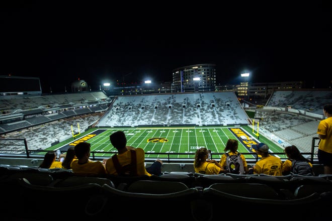University of Iowa freshman students from the class of 2023 look out over the field from the second level in the press box during a behind the scenes tour, Friday, Aug. 23, 2019, at Kinnick Stadium in Iowa City, Iowa.