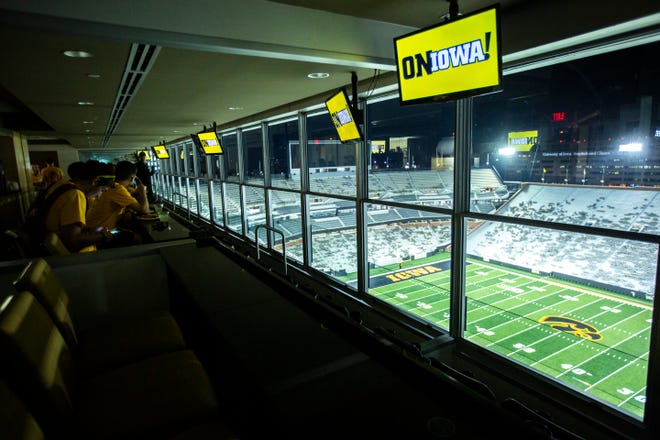 University of Iowa freshman students from the class of 2023 look out over the field from the President's Suite in the press box during a behind the scenes tour, Friday, Aug. 23, 2019, at Kinnick Stadium in Iowa City, Iowa.