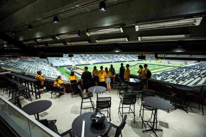 University of Iowa freshman students from the class of 2023 get a behind the scenes tour while looking out of an "Ironman Box", Friday, Aug. 23, 2019, at Kinnick Stadium in Iowa City, Iowa.