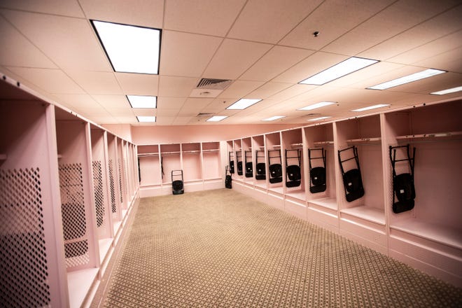 The pink guest locker room is pictured during a behind the scenes tour, Friday, Aug. 23, 2019, at Kinnick Stadium in Iowa City, Iowa.