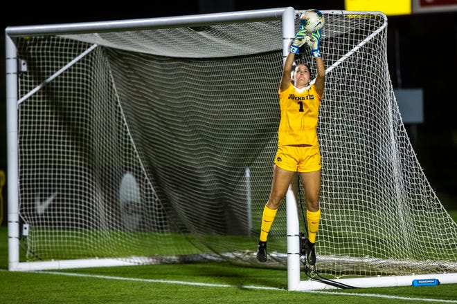 Iowa goalie Claire Graves (1) makes a save during a NCAA women's soccer Cy-Hawk series game, Thursday, Aug. 29, 2019, at the University of Iowa Soccer Complex in Iowa City, Iowa.