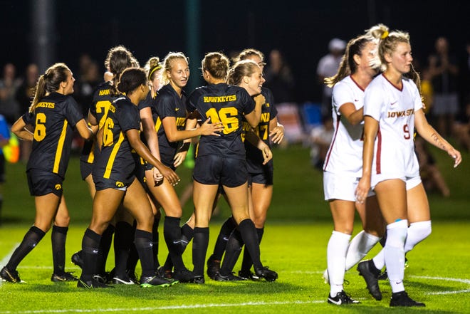 Iowa forward Jenny Cape (19) gets embraced by teammates after scoring a goal during a NCAA women's soccer Cy-Hawk series game, Thursday, Aug. 29, 2019, at the University of Iowa Soccer Complex in Iowa City, Iowa.