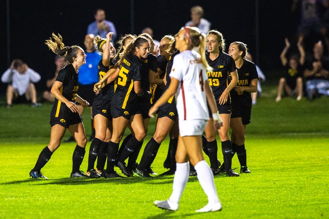 Iowa's Natalie Winter (10) gets embraced by teammates after scoring a goal during a NCAA women's soccer Cy-Hawk series game, Thursday, Aug. 29, 2019, at the University of Iowa Soccer Complex in Iowa City, Iowa.