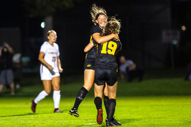 Iowa forward Jenny Cape (19) gets embraced after scoring a goal by teammate Samantha Tawharu, left, during a NCAA women's soccer Cy-Hawk series game, Thursday, Aug. 29, 2019, at the University of Iowa Soccer Complex in Iowa City, Iowa. The Hawkeyes defeated Iowa State, 2-1.
