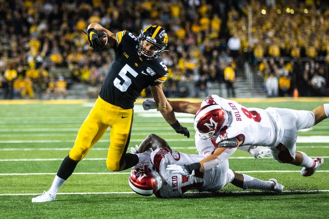 Iowa wide receiver Oliver Martin (5) gets tackled during a NCAA non conference football game, Saturday, Aug. 31, 2019, at Kinnick Stadium in Iowa City, Iowa.