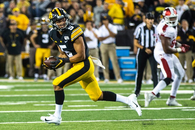 Iowa wide receiver Oliver Martin (5) pulls in a catch during a NCAA non conference football game, Saturday, Aug. 31, 2019, at Kinnick Stadium in Iowa City, Iowa.