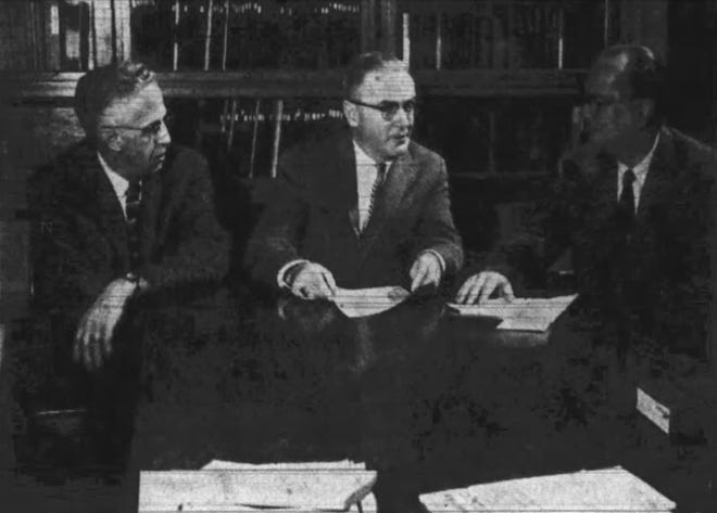 From 1960: J. Paul Mather, center, new president of the American College Testing program, discusses the future of the program with Ted McCarrel, left, who has been serving as ACT general director and Prof. E. F. Lindquist, president of ACT's parent organization, Measurement Research Center, Inc. McCarrel also is a University of Iowa registrar and Lindquist is the director of Iowa Testing programs.