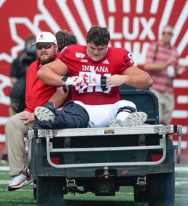 Indiana Hoosiers offensive lineman Coy Cronk (54) rides off the field on a cart during the game against UConn at Memorial Stadium in Bloomington, Ind., on Saturday, Sept. 21, 2019.