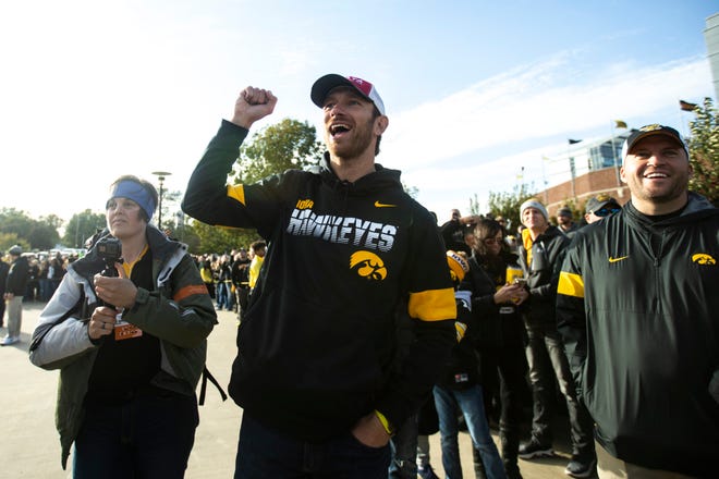 Former Iowa quarterback Ricky Stanzi cheers as the Iowa football busses pull up on Melrose before a NCAA Big Ten Conference football game between the Iowa Hawkeyes and Penn State, Saturday, Oct., 12, 2019, at Kinnick Stadium in Iowa City, Iowa.