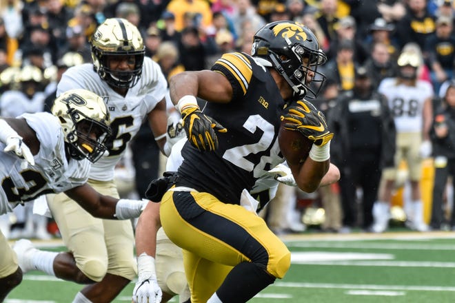 Oct 19, 2019; Iowa City, IA, USA; Iowa Hawkeyes running back Toren Young (28) runs with the ball against the Purdue Boilermakers during the first quarter at Kinnick Stadium. Mandatory Credit: Jeffrey Becker-USA TODAY Sports
