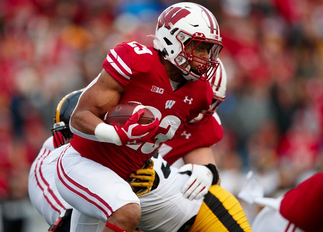Nov 9, 2019; Madison, WI, USA; Wisconsin Badgers running back Jonathan Taylor (23) rushes with the football during the first quarter against the Iowa Hawkeyes at Camp Randall Stadium.