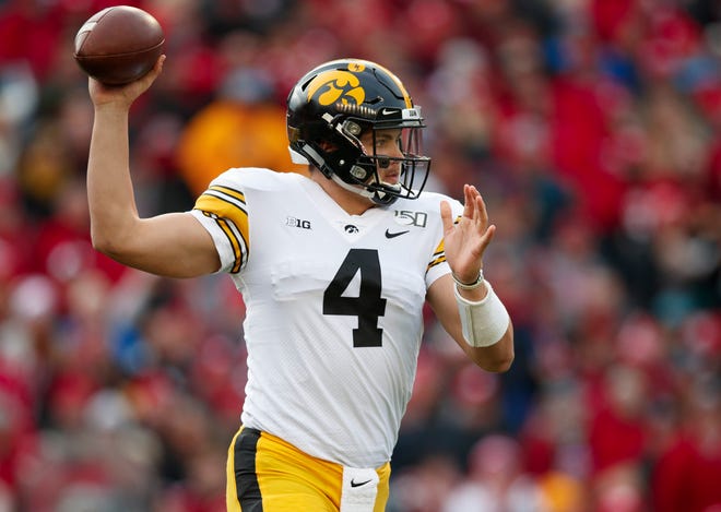 Nov 9, 2019; Madison, WI, USA; Iowa Hawkeyes quarterback Nate Stanley (4) throws a pass during the first quarter against the Wisconsin Badgers at Camp Randall Stadium.