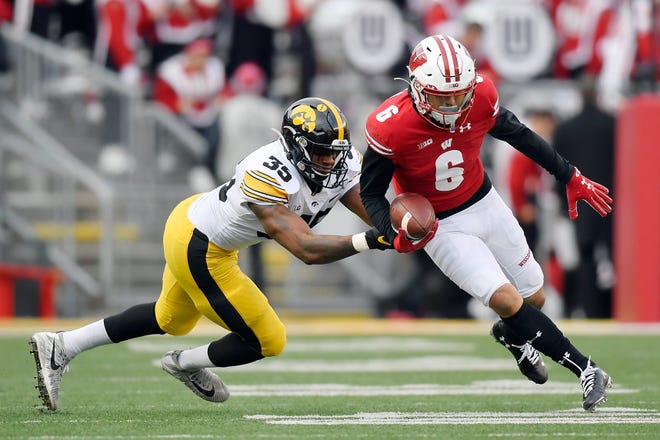 MADISON, WISCONSIN - NOVEMBER 09: Danny Davis III #6 of the Wisconsin Badgers runs with the football in the first half against Barrington Wade #35 of the Iowa Hawkeyes at Camp Randall Stadium on November 09, 2019 in Madison, Wisconsin. (Photo by Quinn Harris/Getty Images)