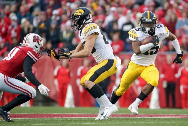 Iowa's Tyler Goodson runs during the first half of an NCAA college football game against Wisconsin Saturday, Nov. 9, 2019, in Madison, Wis. (AP Photo/Morry Gash)
