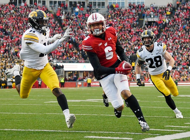 MADISON, WISCONSIN - NOVEMBER 09: Danny Davis III #6 of the Wisconsin Badgers runs with the football to score a touchdown in the first half against the Iowa Hawkeyes at Camp Randall Stadium on November 09, 2019 in Madison, Wisconsin. (Photo by Quinn Harris/Getty Images)