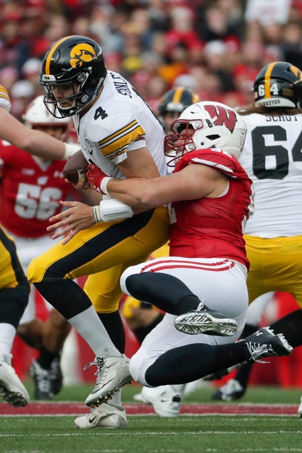 Wisconsin's Matt Henningsen sacks Iowa's Nate Stanley during the first half of an NCAA college football game Saturday, Nov. 9, 2019, in Madison, Wis. (AP Photo/Morry Gash)
