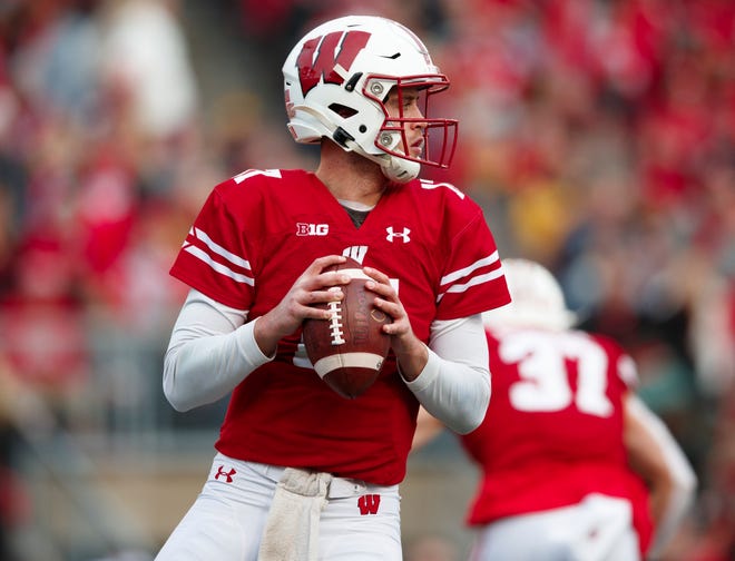 Nov 9, 2019; Madison, WI, USA; Wisconsin Badgers quarterback Jack Coan (17) drops back to pass during the first quarter against the Iowa Hawkeyes at Camp Randall Stadium.
