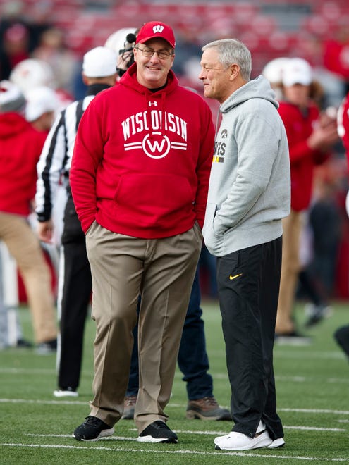 Nov 9, 2019; Madison, WI, USA; Wisconsin Badgers head coach Paul Chryst talks with Iowa Hawkeyes head coach Kirk Ferentz during warmups prior to the game at Camp Randall Stadium.