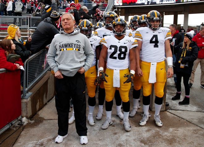 Nov 9, 2019; Madison, WI, USA; Iowa Hawkeyes head coach Kirk Ferentz stands in front of the team prior to taking the field prior to the game against the Wisconsin Badgers at Camp Randall Stadium.