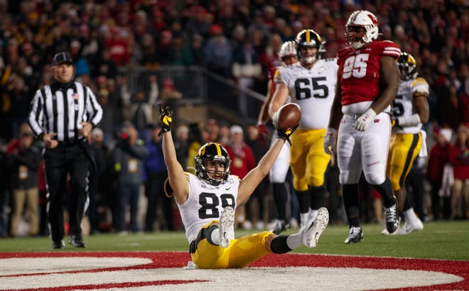 Nov 9, 2019; Madison, WI, USA; Iowa Hawkeyes wide receiver Nico Ragaini (89) celebrates after scoring a touchdown during the fourth quarter against the Wisconsin Badgers at Camp Randall Stadium. Mandatory Credit: Jeff Hanisch-USA TODAY Sports