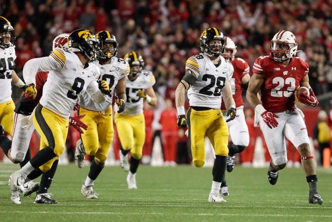 Wisconsin's Jonathan Taylor runs during the second half of an NCAA college football game against Iowa Saturday, Nov. 9, 2019, in Madison, Wis. Wisconsin won 24-22. (AP Photo/Morry Gash)