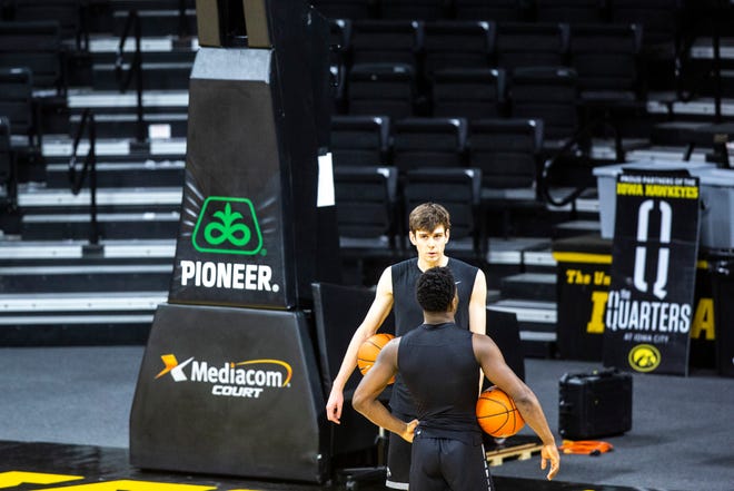 Iowa's Patrick McCaffery talks with teammate Joe Toussaint, right, after a NCAA non-conference men's basketball game, Monday, Nov., 11, 2019, at Carver-Hawkeye Arena in Iowa City, Iowa.