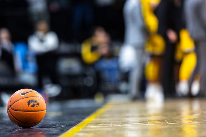 An Iowa basketball with a Tigerhawk logo rests along the baseline during a NCAA non-conference men's basketball game, Monday, Nov., 11, 2019, at Carver-Hawkeye Arena in Iowa City, Iowa.