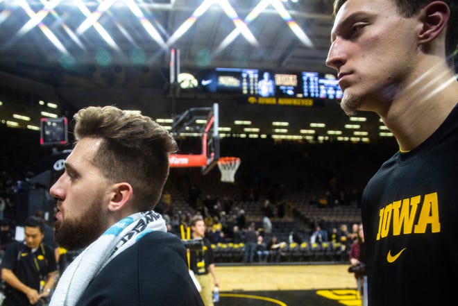 Iowa guard Jordan Bohannon (3) and Jack Nunge walk off the court during a NCAA non-conference men's basketball game, Monday, Nov., 11, 2019, at Carver-Hawkeye Arena in Iowa City, Iowa.