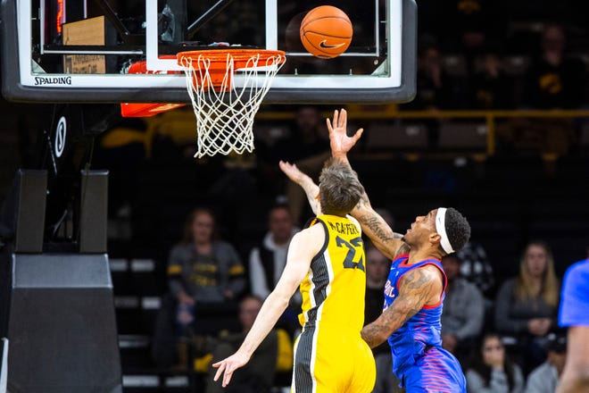 Iowa forward Patrick McCaffery (22) attempts to defend a shot from DePaul's Paul Reed during a NCAA non-conference men's basketball game, Monday, Nov., 11, 2019, at Carver-Hawkeye Arena in Iowa City, Iowa.