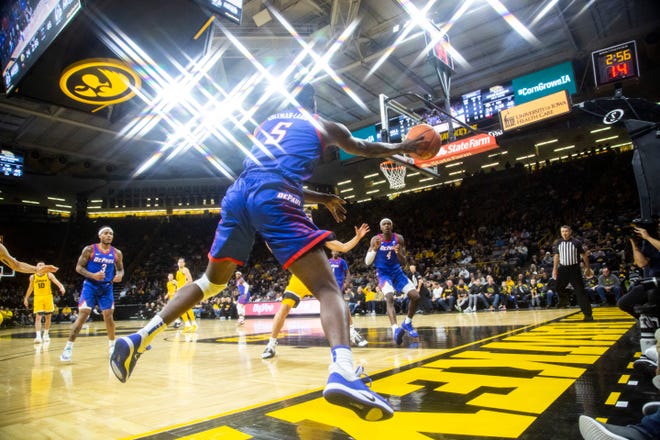 DePaul's Jalen Coleman-Lands (5) leaps to keep a ball in bounds during a NCAA non-conference men's basketball game, Monday, Nov., 11, 2019, at Carver-Hawkeye Arena in Iowa City, Iowa.