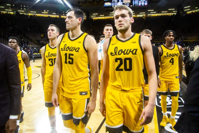 Iowa players Joe Toussaint, from left, Connor McCaffery (30) Ryan Kriener (15) Joe Wieskamp (10) Riley Till (20) and Bakari Evelyn (4) walk off the court after a NCAA non-conference men's basketball game, Monday, Nov., 11, 2019, at Carver-Hawkeye Arena in Iowa City, Iowa.
