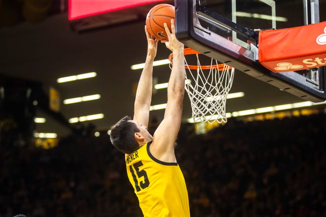 Iowa forward Ryan Kriener (15) dunks during a NCAA non-conference men's basketball game, Monday, Nov., 11, 2019, at Carver-Hawkeye Arena in Iowa City, Iowa.