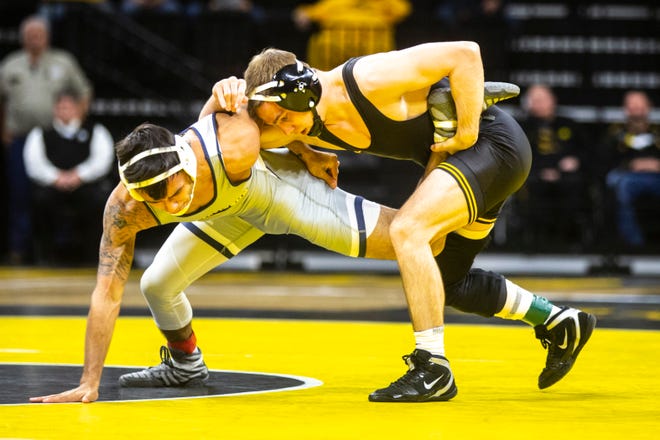 Iowa's Spencer Lee wrestles University of Tennessee-Chattanooga's Fabian Gutierrez at 125 pounds during a NCAA non-conference wrestling dual, Sunday, Nov., 17, 2019, at Carver-Hawkeye Arena in Iowa City, Iowa.