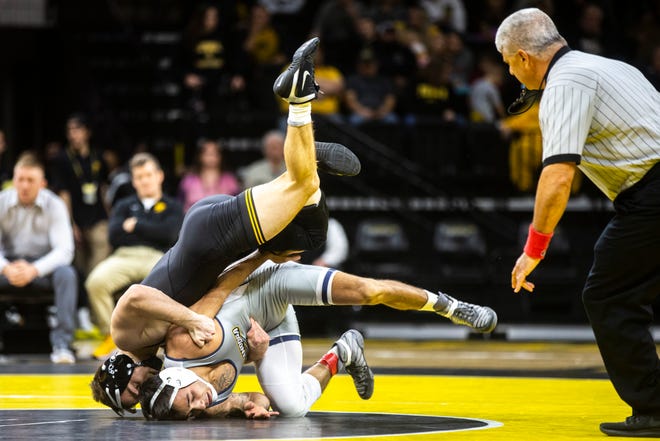 Iowa's Spencer Lee wrestles University of Tennessee-Chattanooga's Fabian Gutierrez at 125 pounds during a NCAA non-conference wrestling dual, Sunday, Nov., 17, 2019, at Carver-Hawkeye Arena in Iowa City, Iowa.