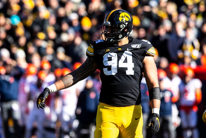 Iowa defensive end A.J. Epenesa (94) reacts after a play during a NCAA Big Ten Conference football game, Saturday, Nov. 23, 2019, at Kinnick Stadium in Iowa City, Iowa.