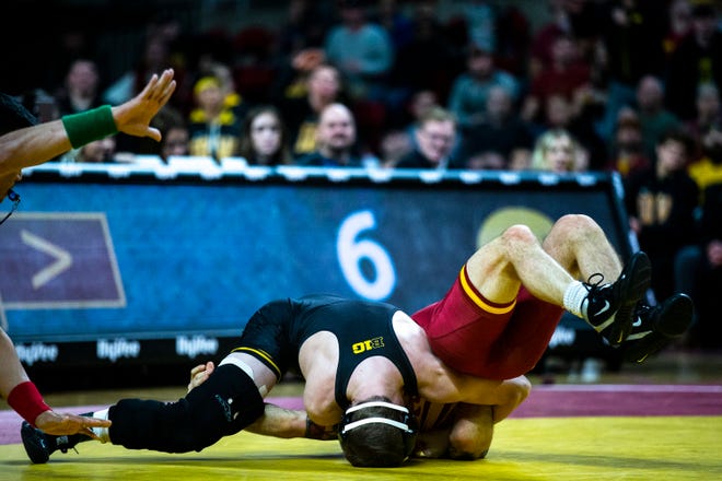 Iowa's Spencer Lee wrestles Iowa State's Alex Mackall at 125 during the Cy-Hawk dual on Sunday, Nov. 17, 2019, in Hilton Coliseum.
