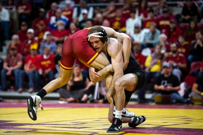 Iowa's Carter Happel wrestles Iowa State's Ian Parker at 141 during the Cy-Hawk dual on Sunday, Nov. 17, 2019, in Hilton Coliseum.