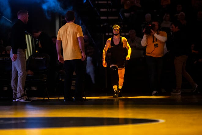 Iowa's Spencer Lee is introduced before a match at 125 pounds during a NCAA Big Ten Conference wrestling dual, Sunday, Dec. 1, 2019, at Carver-Hawkeye Arena in Iowa City, Iowa.