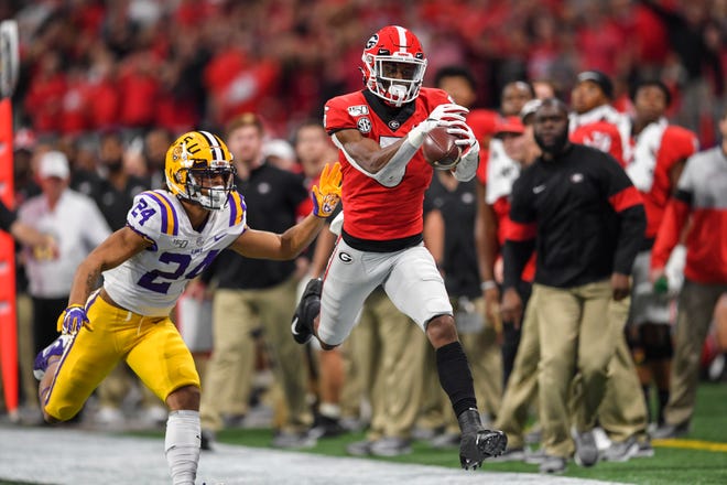 Georgia wide receiver Matt Landers catches a pass against LSU cornerback Derek Stingley Jr. but lands out of bounds during the first quarter in the 2019 SEC championship game at Mercedes-Benz Stadium.