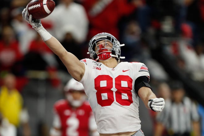 Ohio State Buckeyes tight end Jeremy Ruckert scores a touchdown against the Wisconsin Badgers during the third quarter of the Big Ten title game.