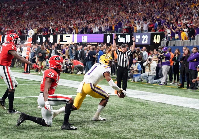 LSU Tigers wide receiver Ja'Marr Chase celebrates his against the Georgia Bulldogs during the first quarter of the the SEC championship game at Mercedes-Benz Stadium.