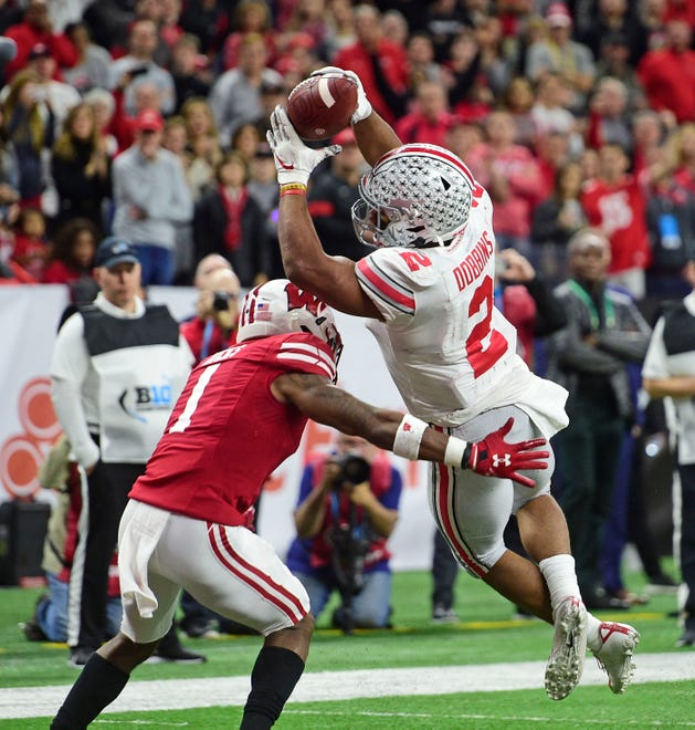 Ohio State running back J.K. Dobbins scores a touchdown against the Wisconsin Badgers during the first half in the Big Ten title game.
