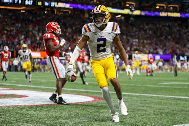 LSU wide receiver Justin Jefferson scores a touchdown against the Georgia during the third quarter of the SEC championship game at Mercedes-Benz Stadium.