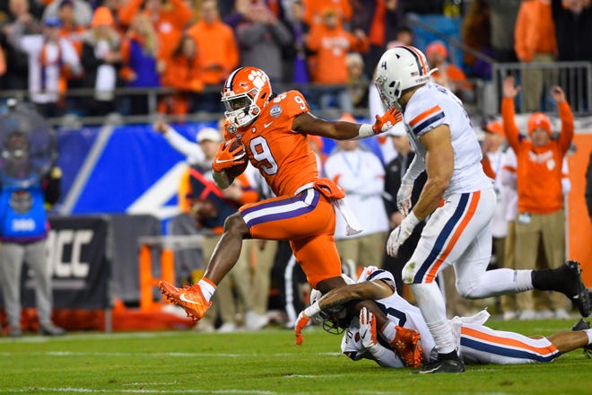 Clemson Tigers running back Travis Etienne (9) runs for a touchdown against the Virginia Cavaliers in the second quarter of the ACC championship game.