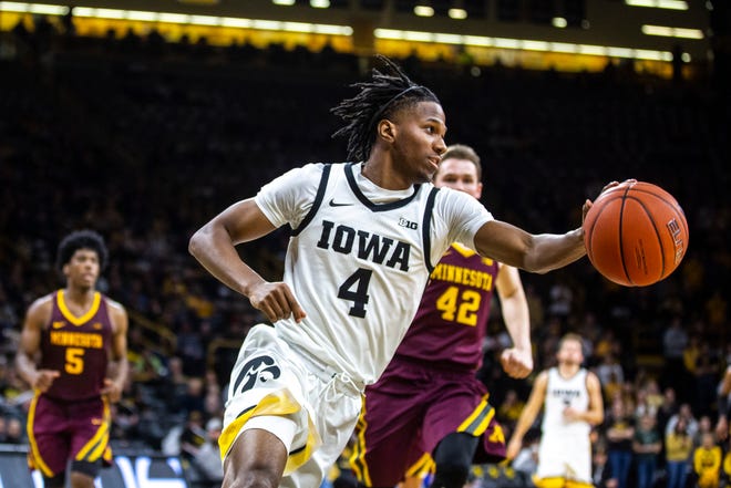 Iowa guard Bakari Evelyn (4) makes a save during a NCAA Big Ten Conference men's basketball game, Monday, Dec. 9, 2019, at Carver-Hawkeye Arena in Iowa City, Iowa.