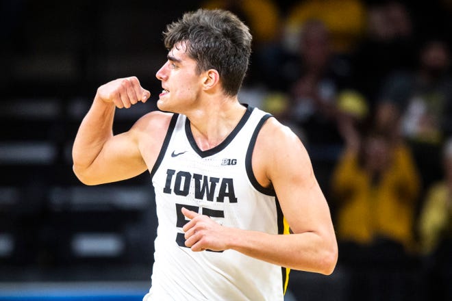 Iowa center Luka Garza (55) flexes after making a basket during a NCAA Big Ten Conference men's basketball game, Monday, Dec. 9, 2019, at Carver-Hawkeye Arena in Iowa City, Iowa.